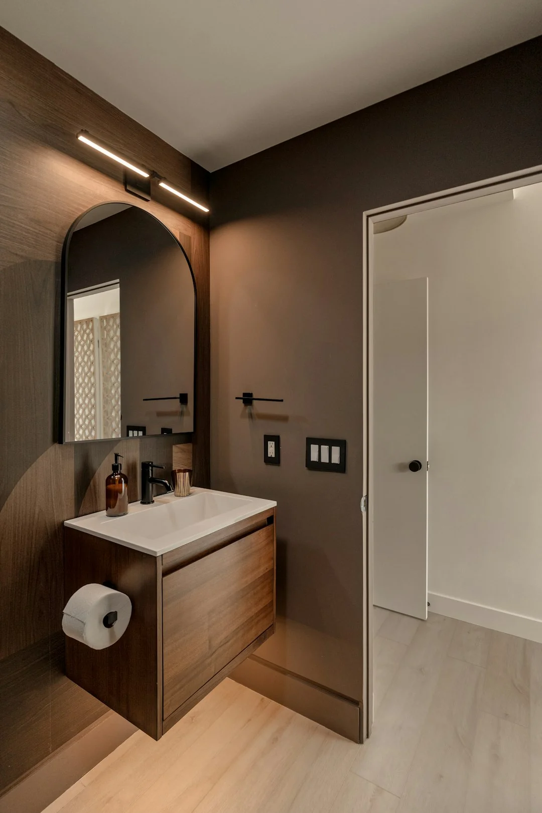 Housekeeper organizing towels in a hotel room, showcasing the art of cleanliness and service.